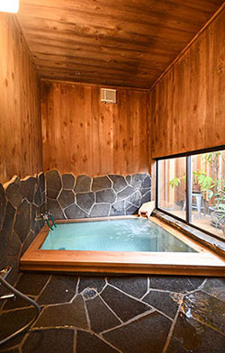 Bathroom made with wood and natural stone